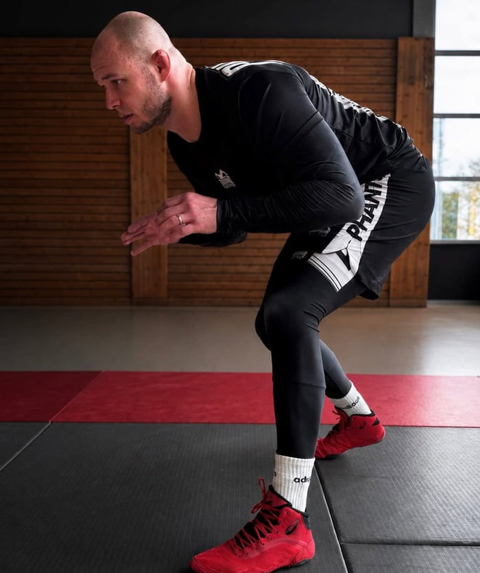 Ringer Vladi Jungemann mit Phantom Athletics Rashguard, Tights und Fight Shorts im Training