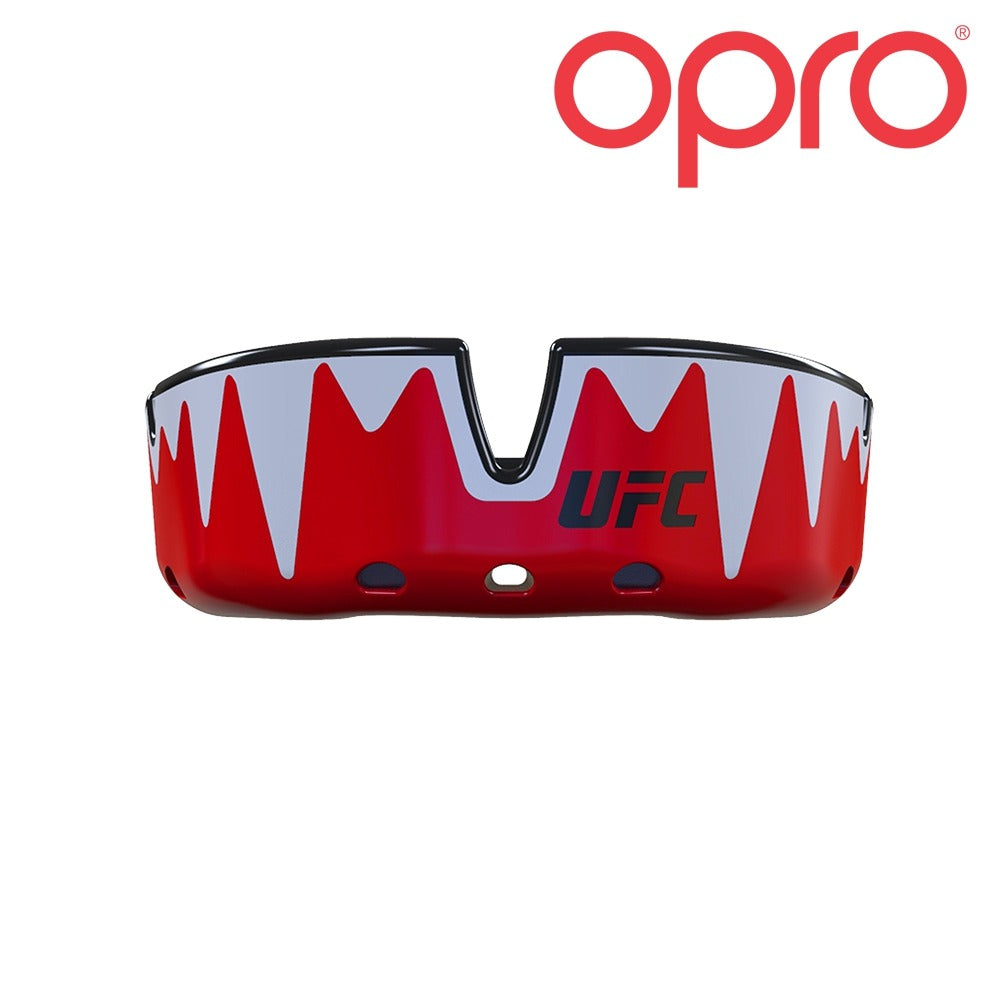 Mit der innovativen Fin-Technologie passt sich der OPRO UFC Platinum Fangz Zahnschutz in Rot/Silber perfekt an die Zahnstruktur an und sorgt für einen sicheren Sitz. Die duale Schichtkonstruktion bietet zusätzlichen Aufprallschutz und Komfort.
