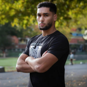 Neutral‑schwarzes Kampfsport‑T‑Shirt Phantom Athletics Germany NBD – repräsentiert dein Land und deinen Sport, mit robustem Material und dynamischem Fit für Trainingsalltag und Wettkampf.