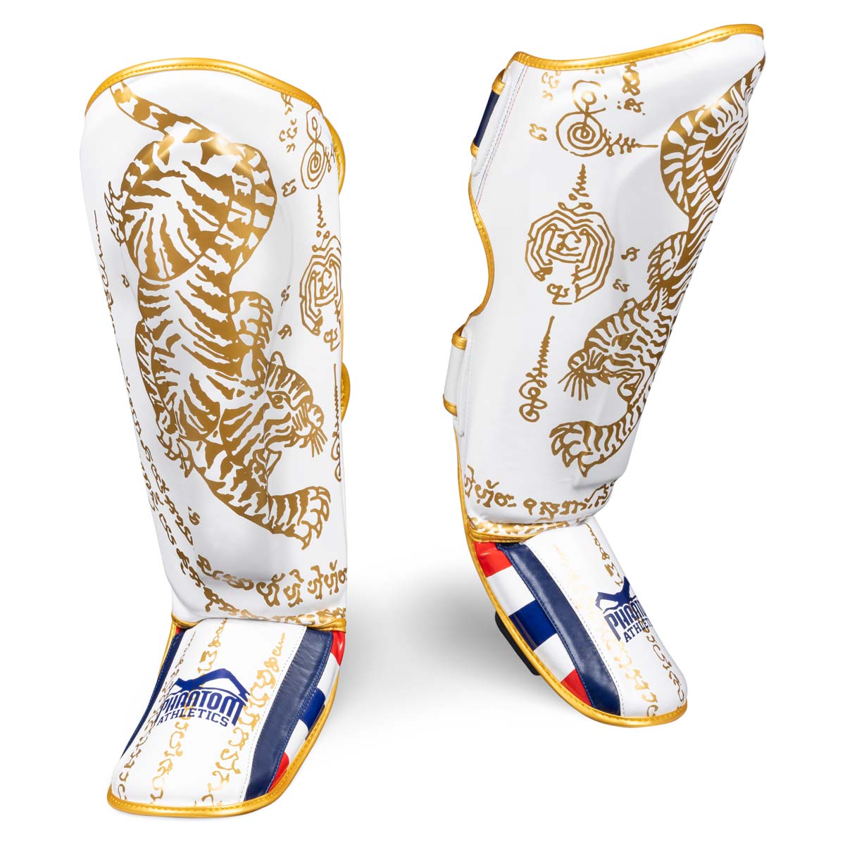 Phantom Muay Thai shin guard for Thai boxing and MMA sparring, competition and training. In the traditional Sak Yant design and the limited color white/gold.