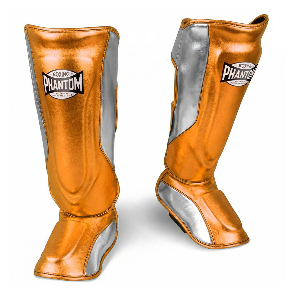 Hochwertige Phantom Athletics Shinpads MEXICO in Orange und Silber, ideal für intensives Kampfsport‑Training im Muay Thai, Kickboxen und MMA mit elastischem Komfort und zuverlässigem Schutz bei Kicks und Sparring. Diese robusten Schienbeinschoner verbinden auffälliges Mexico‑Design mit langlebiger Polsterung für maximale Performance im Gym.