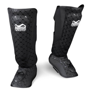 Phantom ELITE Schienbeinschützer – robuster Stand-Up Schutz aus hochwertigem PU-Leder, mit doppeltem Klettverschluss und starker Polsterung für Muay Thai, Kickboxen oder MMA Sparring.