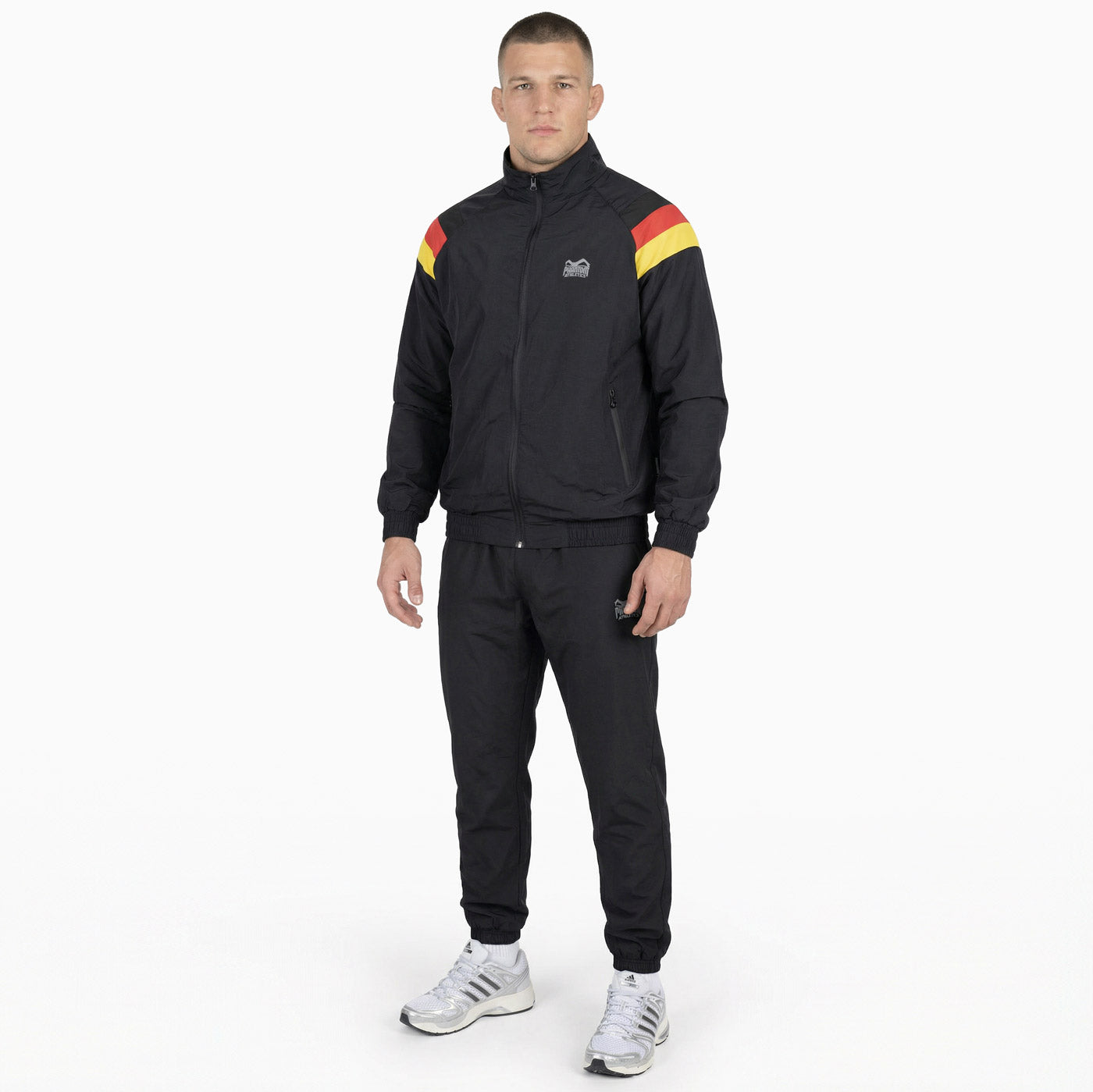 Funktioneller Phantom Athletics Trainingsanzug DMC Team Germany im Retro‑Design mit lockerem Schnitt, ideal für Aufwärmen, MMA‑Training und Fitness‑Workouts.
