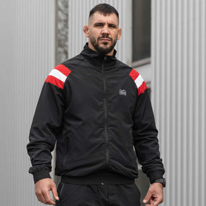 Die Phantom Athletics Trainingsjacke DMC Team Austria kombiniert sportliches Design mit hoher Funktionalität. Das leichte, atmungsaktive Material sorgt für optimalen Komfort bei Training und Freizeit.