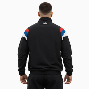 Premium Trainingsjacke DMC Team Serbia von Phantom Athletics – Retro‑Design kombiniert mit funktionalem Material, lockerer Schnitt und hoher Markenqualität für Sparring und Gym.
