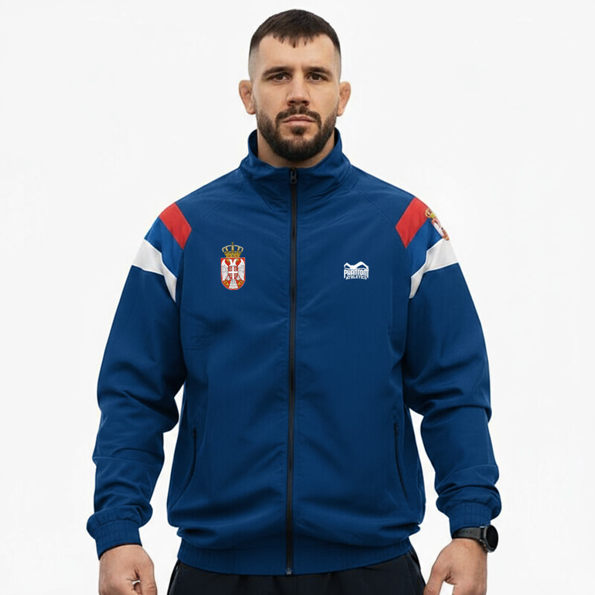 Premium Marke Phantom Athletics Track Jacket „DMC Team Serbia“ in Blau – funktionale Trainingsjacke im Retro‑Look, ideal für MMA, Boxen oder Fitness‑Training.