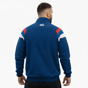 Hochwertige Trainingsjacke „DMC Team Serbia“ – atmungsaktives Performance‑Material, Mesh‑Futter und Team‑Serbia‑Akzente in Blau/Rot/Weiß, perfekt für Kampfsport‑Athleten.