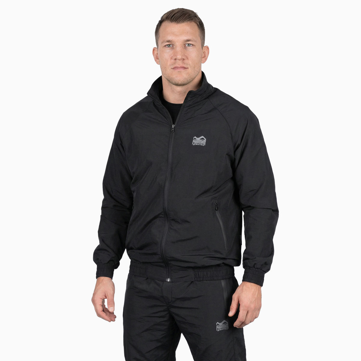 Funktioneller Kampfsport‑Tracksuit von Phantom Athletics in Schwarz mit atmungsaktivem Material für Boxen, Kickboxen und Sparring‑Workouts.