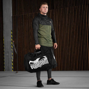 Phantom Athletics Gymbag Team, ideal für Kampfsportler und Wettkämpfer. Diese strapazierfähige Sporttasche bietet ausreichend Platz für Boxhandschuhe, Schutzausrüstung, Kleidung und Zubehör, perfekt für Training und Turniere.