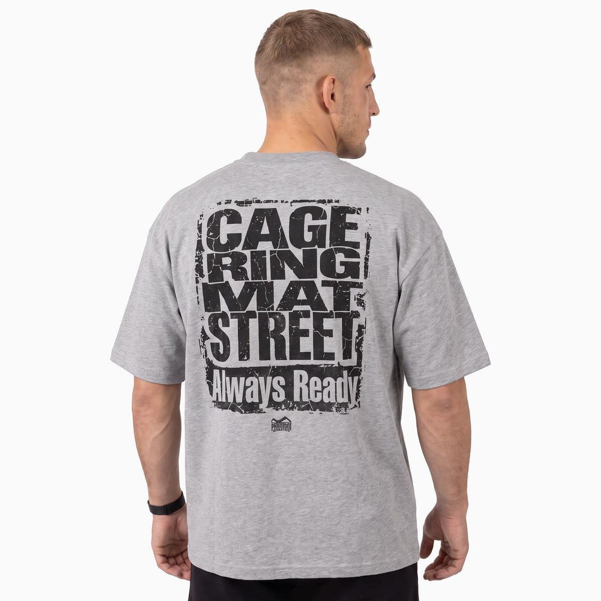 Das Phantom Athletics Oversize T-Shirt CAGE RING MAT STREET in Grau kombiniert einen modernen Oversize Fit mit einem markanten schwarzen Rückenprint. Die hochwertige Kampfsportbekleidung eignet sich ideal für MMA, Boxen, Kickboxen, Muay Thai, BJJ und Grappling.