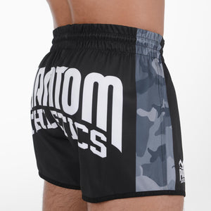 Die Fight Shorts Revolution Black Camo von Phantom Athletics vereinen stilvolles Tarnmuster mit maximaler Funktionalität – ideal für intensive MMA-, Grappling- und Kickbox-Einheiten.