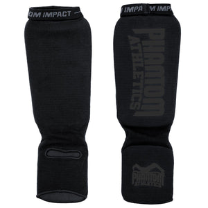 Robuster Schienbeinschutz aus der Impact-Serie in der Blackout Edition – speziell für fortgeschrittene Kampfsportler im Thaiboxen, Kickboxen oder MMA. Doppelte Polsterzonen für maximale Sicherheit bei jedem Schlagabtausch.