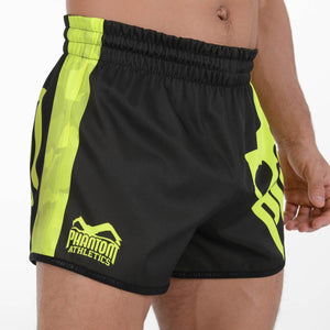 Revolution Black Neon Fight Shorts von Phantom Athletics, die perfekte Wahl für MMA- und Grappling-Training. Mit ihrem markanten Neon-Look und ihrer Strapazierfähigkeit heben sie sich auf jeder Matte ab.